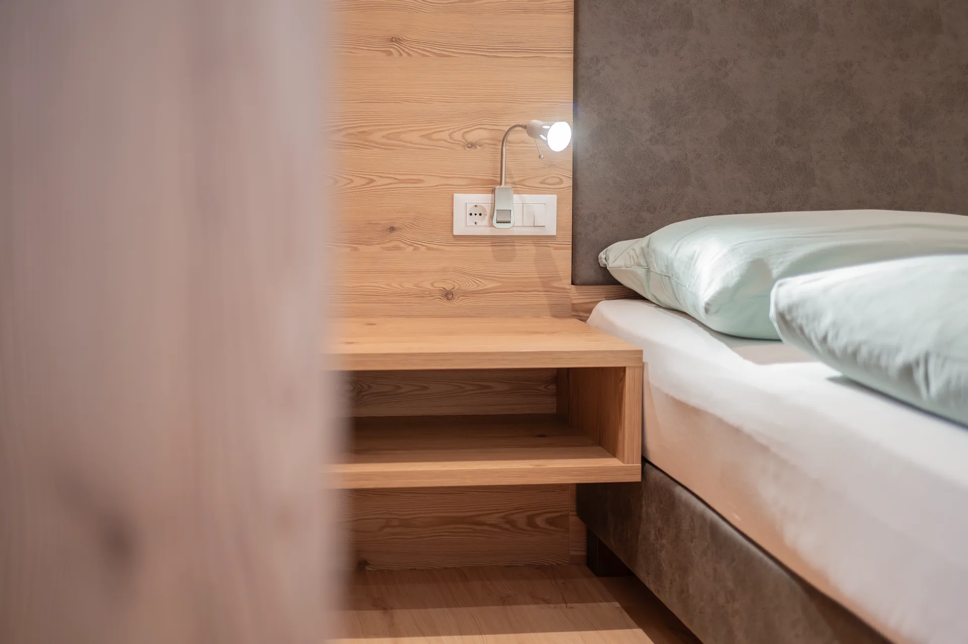 Bett im Apartment Bergblick